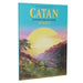 Catan Hawai'i paplašinājuma kaste ar tropisku saulrieta ainavu, palmām un kalniem uz zila fona.