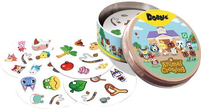 Dobble Animal Crossing galda spēle apaļā metāla kārbā ar krāsainām kārtīm, uz kurām attēloti spēles tēli un priekšmeti.