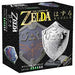 Sudrabota metāla Huzzle Hylian Shield prāta spēle Zelda iepakojumā ar detalizētu vairoga dizainu un sarežģītības līmeni.