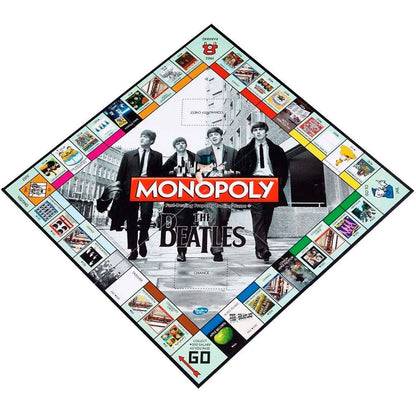Monopoly The Beatles galda spēles laukums ar grupas dalībnieku fotogrāfiju un tematiskiem īpašumu lauciņiem.