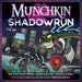 Munchkin Shadowrun galda spēles kaste ar kiberpanka ilustrāciju, kurā redzams pūķis un futūristiska pilsēta tumšos toņos.