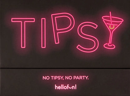 Tipsy dzeršanas spēles melna kaste ar koši rozā neona uzrakstu un kokteiļglāzes simbolu.