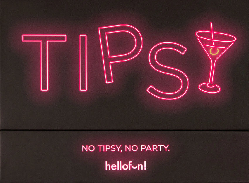 Tipsy dzeršanas spēles melna kaste ar koši rozā neona uzrakstu un kokteiļglāzes simbolu.