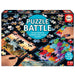 Puzzle Battle galda spēle ar 12 krāsainiem puzles komplektiem sacensībām, melnā kastē ar 42 gabaliņu puzlēm.