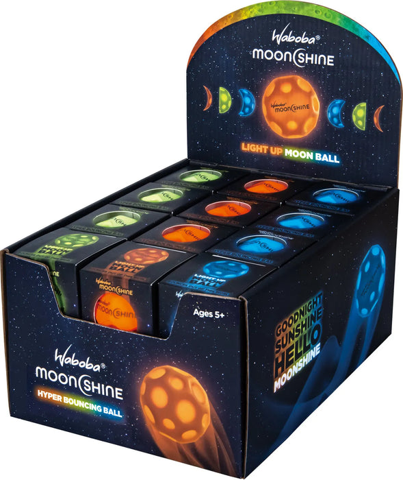 Waboba MoonShine 6,35 cm tumsā spīdošas bumbiņas displeja kastē ar oranžām, zaļām un zilām krāsām.
